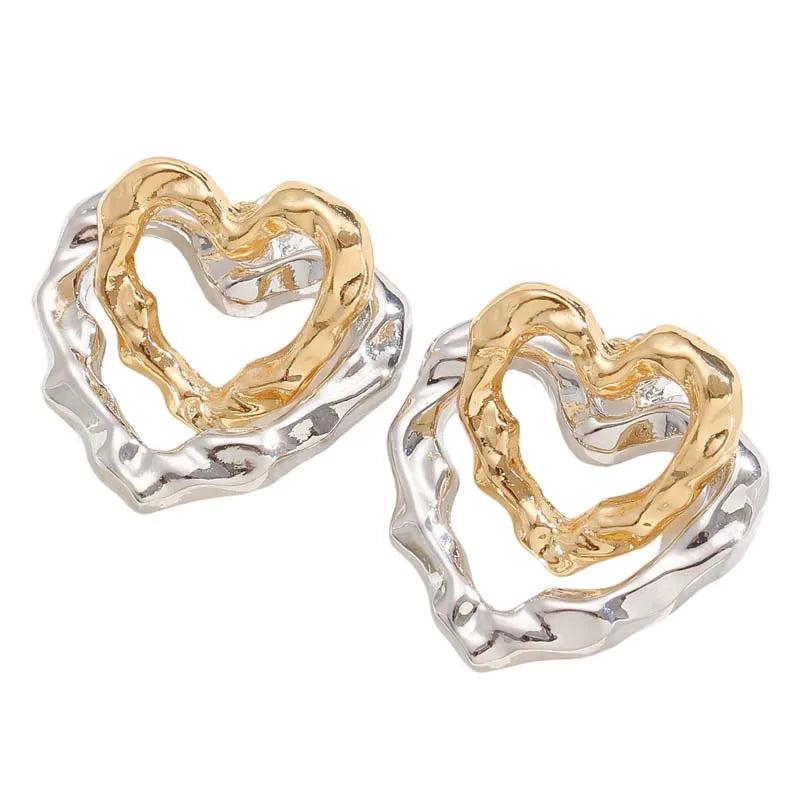 Pair of Heartelle earrings laid flat