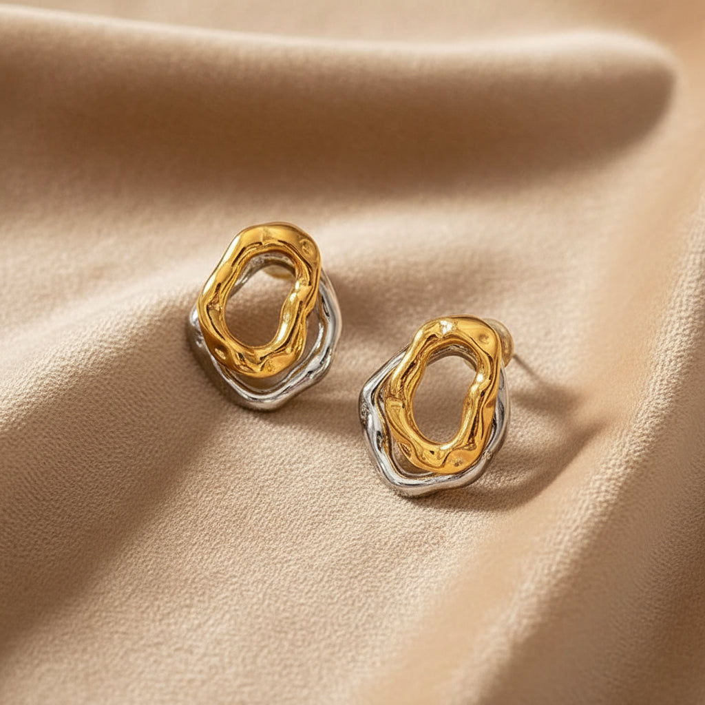 Heartelle earrings shown on a neutral background